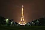 "The Eiffel Tower at night seen from the Champ de Mars"